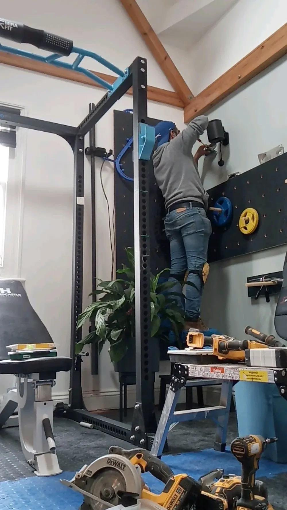 Omar installing home gym equipment